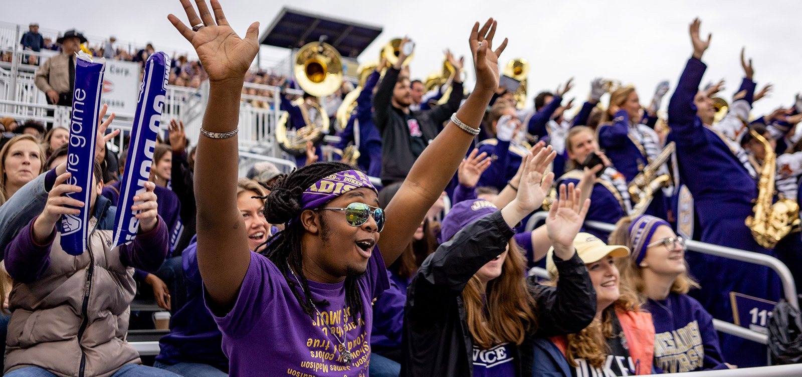 Crowd cheering at a JMU football game